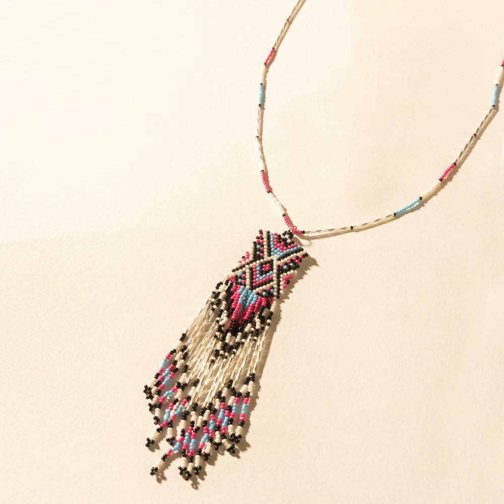 Myra Sky and Coral in necklace in Turquoise