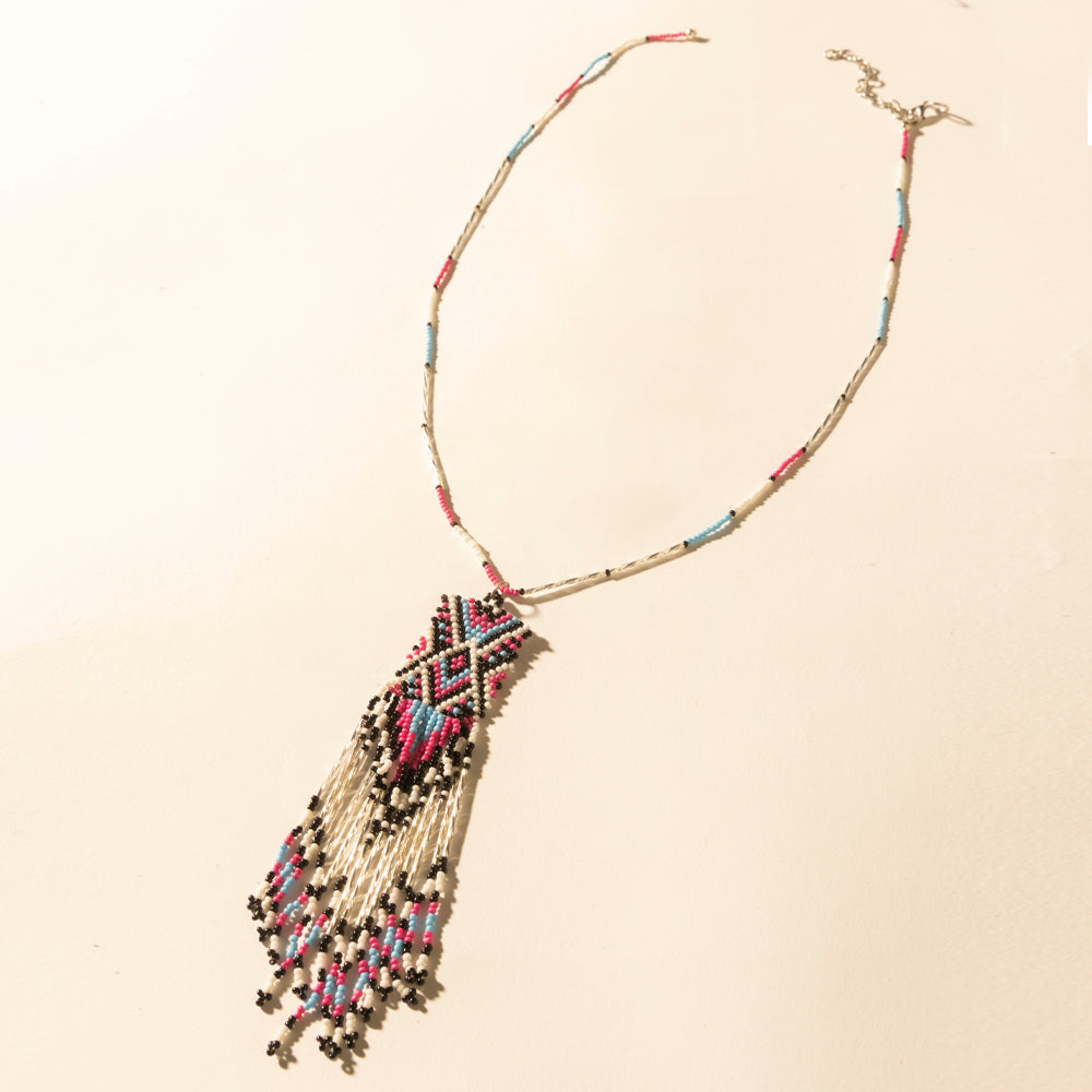 Myra Sky and Coral in necklace in Turquoise